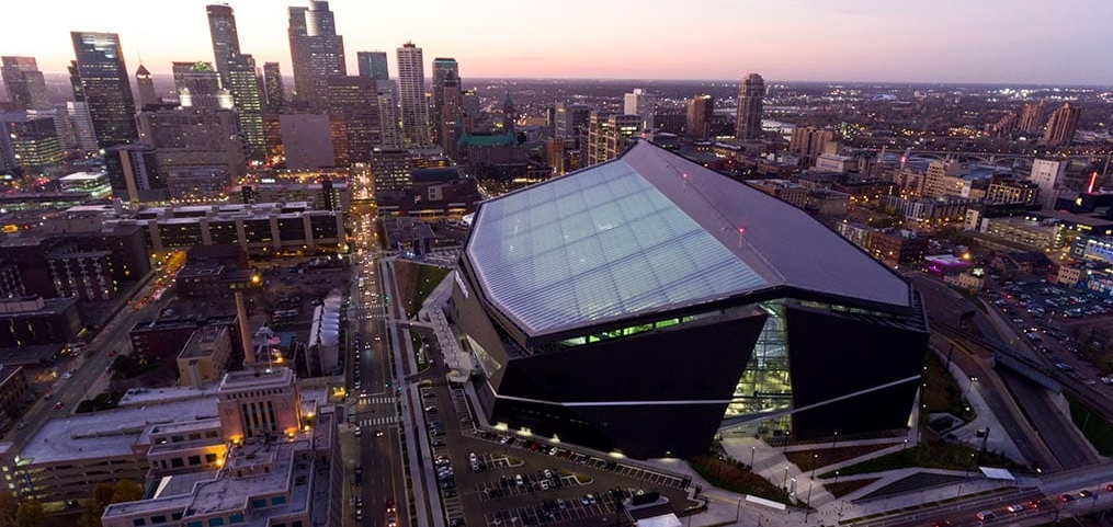 US Bank Stadium and Minneapolis skyline at dusk.