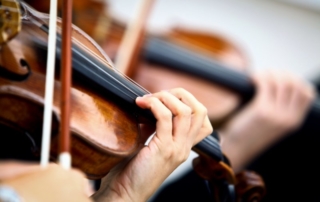 Close up of violin player.