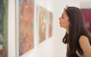 Woman looking at a painting.