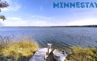 Lakefront dock and boat. Text: Minnestay.