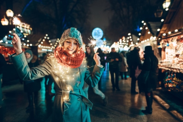 Woman with Christmas lights around her scarf.