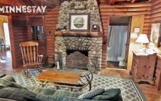 Cabin living room and fireplace.