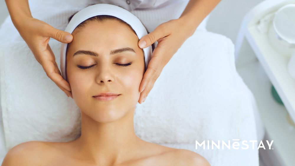 Woman getting a facial at one of the top tier spa picks by MINNeSTAY