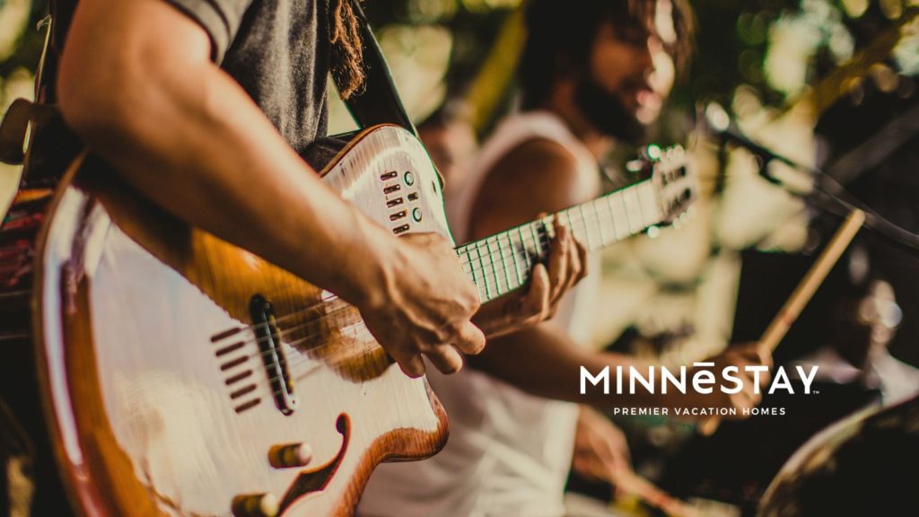 Musicians playing electric guitar at one of the many musical events in the Minneapolis, Minnesota area